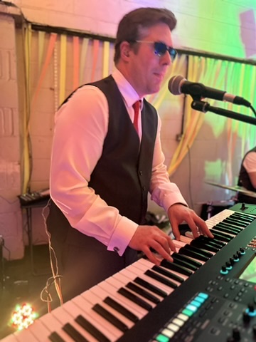 older man having his hair blow dried