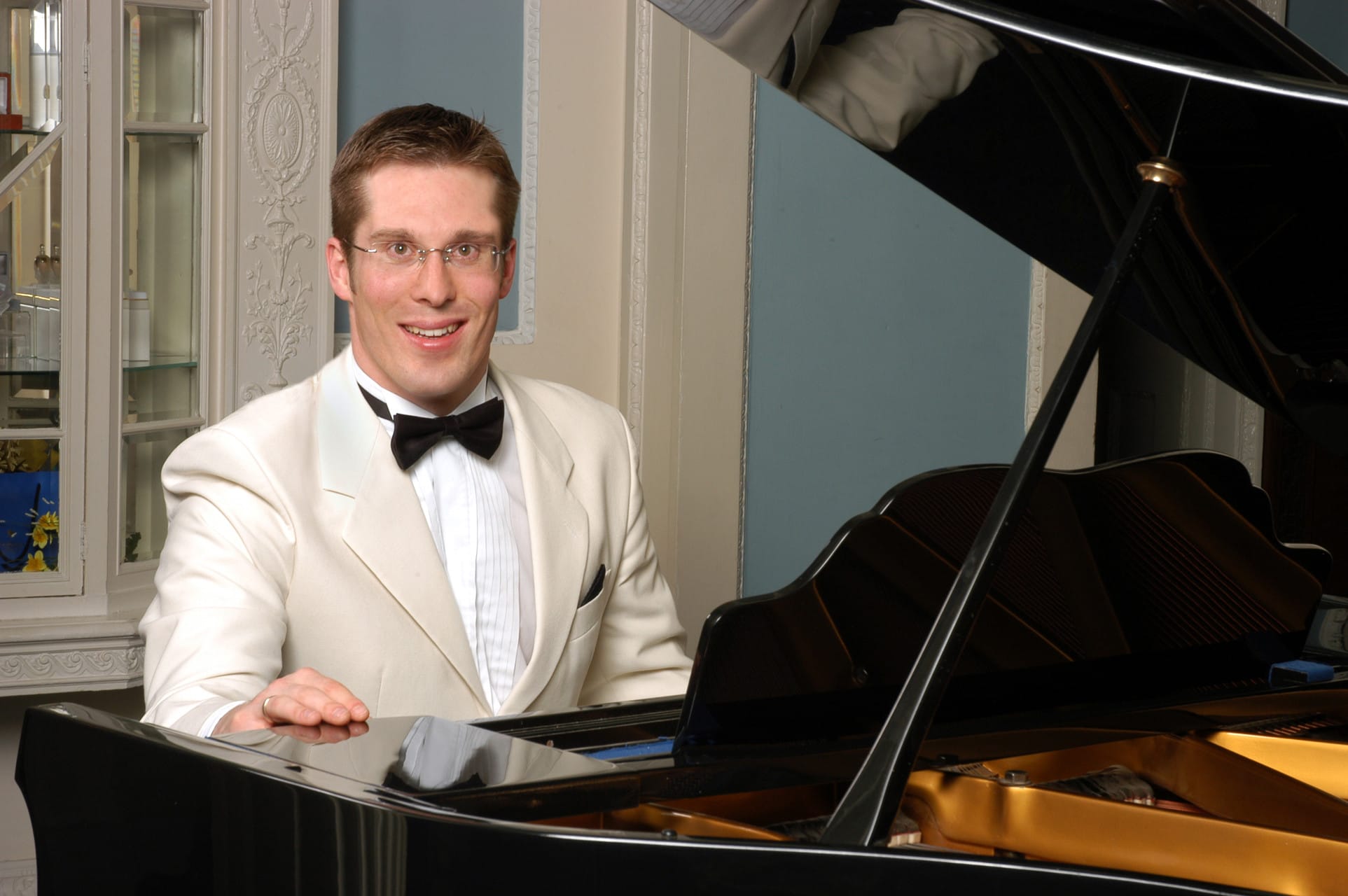 young man side profile having beard trimmed with scissors